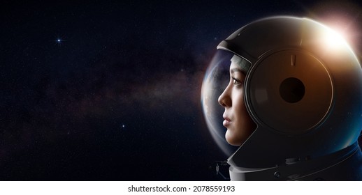 Head Shot Of Attractive Female Astronaut Wearing A Helmet In Outer Space Looking At Planet Earth. 3D Rendering. Concept Of Space Travel And Exploration.