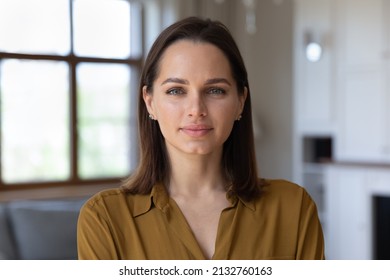 Head shot beautiful young 30s female standing in fashionable living room alone pose looking at camera. Homeowner or apartment renter person, pretty housewife portrait, natural womens beauty concept - Shutterstock ID 2132760163