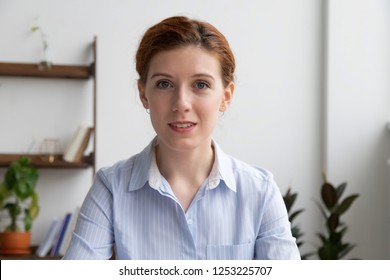 Head Shot Businesswoman Sitting In Office Room Or Home Looking At Web Camera Using Computer. Executive Manager Or Representative Of Company Make Video Call Conference Communicating Online With Client