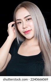 head shot of caucasian beauty girl ashen hair wear black t shirt with studio lighting for cosmatic black background - Shutterstock ID 2240666069