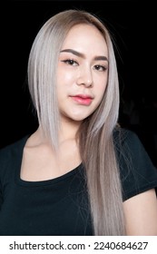 head shot of caucasian beauty girl ashen hair wear black t shirt with studio lighting for cosmatic black background - Shutterstock ID 2240684627