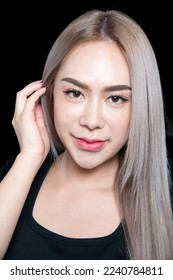 head shot of caucasian beauty girl ashen hair wear black t shirt with studio lighting for cosmatic black background - Shutterstock ID 2240784811