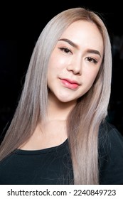 head shot of caucasian beauty girl ashen hair wear black t shirt with studio lighting for cosmatic black background - Shutterstock ID 2240849723
