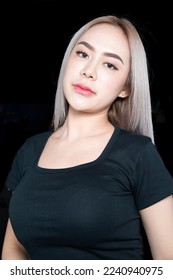 head shot of caucasian beauty girl ashen hair wear black t shirt with studio lighting for cosmatic black background - Shutterstock ID 2240940975