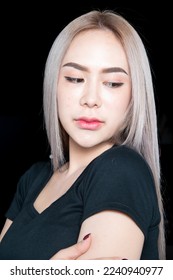 head shot of caucasian beauty girl ashen hair wear black t shirt with studio lighting for cosmatic black background - Shutterstock ID 2240940977