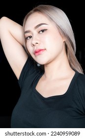 head shot of caucasian beauty girl ashen hair wear black t shirt with studio lighting for cosmatic black background - Shutterstock ID 2240959089