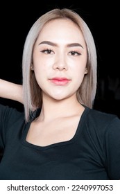 head shot of caucasian beauty girl ashen hair wear black t shirt with studio lighting for cosmatic black background - Shutterstock ID 2240997053