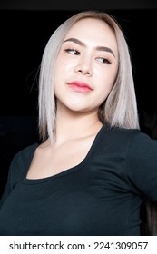 head shot of caucasian beauty girl ashen hair wear black t shirt with studio lighting for cosmatic black background - Shutterstock ID 2241309057