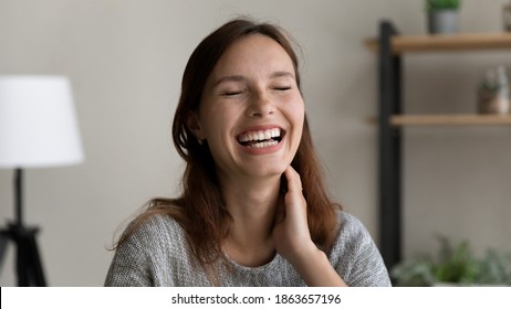 Head Shot Close Up Happy Young Caucasian Red-haired Woman Laughing At Funny Joke, Feeling Overjoyed Of Hearing Good News Or Entertaining Holding Video Call Meeting With Best Friends, Screen View.