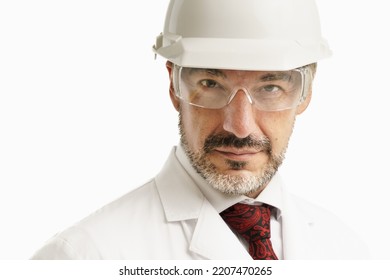 Head Shot Close Up Portrait Of Senior Man Wearing White Hard Hat And Eye Protective Glasses And Looking At Camera.