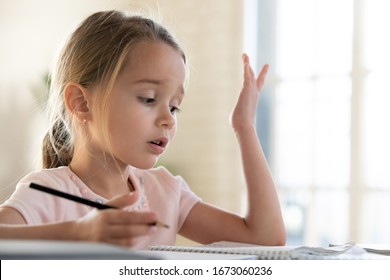 Head Shot Close Up Small Stressed Girl Stuck With Hard Homework. Upset Little Schoolgirl Do Not Understand Task. Unhappy Child Kid Having Problem With School Subject. Children Education Problem.