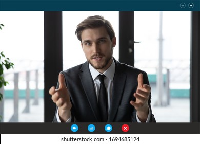 Head Shot Of Confident Businessman In Suit Talk With Partner Company Client Or Investor Use Video Call App, Laptop Screen View. Easy Comfort Negotiations Distantly, Coach Provide Info Remotely Concept