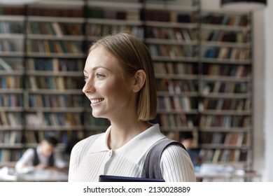 Head Shot Dreamy Motivated Female Caucasian Student Looking Away, Lost In Good Thoughts, Thinking Over University Exams Or Assignments, Posing In Modern Library, High School Education Concept.