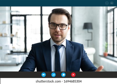 Head shot employer lead job interview with applicant laptop screen teleconference app view. Businessman talk with client by video call communicating distantly use modern videoconference and pc concept