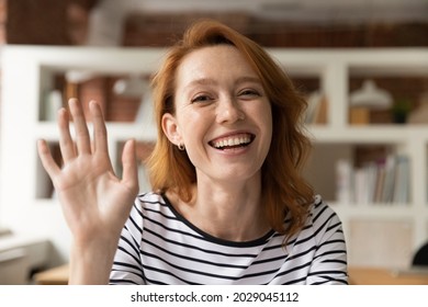 Head Shot Happy Young Woman Greeting Friend Talks To Webcam Participate In Videoconference Negotiate To Client Using App, Modern Tech, Internet Connection. Video Call Event For Work And Study Concept