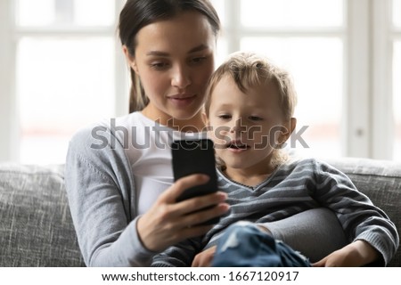 Similar – Image, Stock Photo Joyful mother and son sharing a Christmas moment