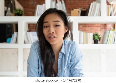 Head shot portrait Asian online teacher woman speaking by webcam, distant learning language, looking at camera, job interview, teenage girl making video call, female vlogger recording vlog