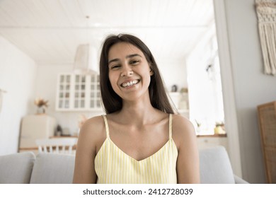 Head shot portrait attractive young woman staring at camera, using videocall application for remote, distancing communication with family or friend. Virtual meeting event at home, modern technologies - Powered by Shutterstock