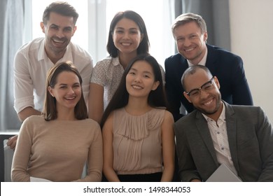 Head Shot Portrait Of Cheerful Smiling Mixed Race Colleagues, Looking At Camera. Happy Professional Multicultural International Team, Satisfied Diverse Corporate Workers Employees Posing For Photo.