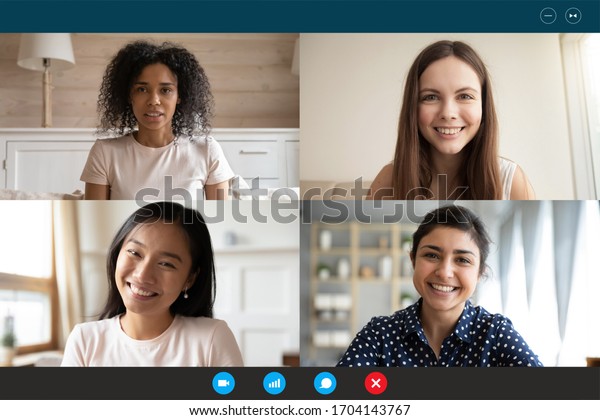 Head shot portrait four multiethnic millennial girls using video call ...