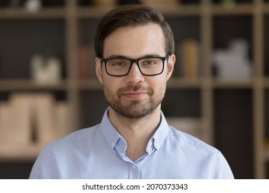 Head Shot Portrait Of Happy Confident 30s Young Male Ceo Executive Manager Businessman Employee Worker In Eyewear Posing In Modern Workplace, Profile Photo, Successful Corporate Career Concept.