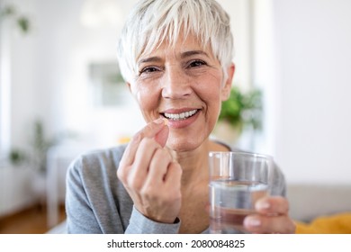 Head Shot Portrait Happy Woman Holds Pill Glass Of Water, Takes Daily Medicine Vitamin D, Omega 3 Supplements, Skin Hair Nail Strengthen And Beauty, Medication For Health Care Concept