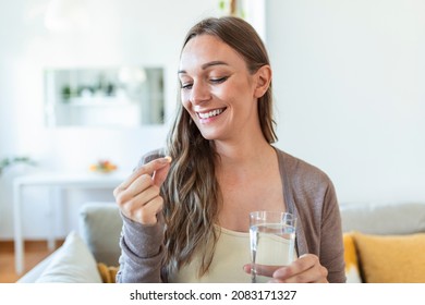 Head Shot Portrait Happy Woman Holds Pill Glass Of Water, Takes Daily Medicine Vitamin D, Omega 3 Supplements, Skin Hair Nail Strengthen And Beauty, Medication For Health Care Concept