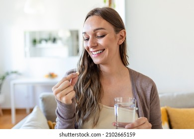 Head Shot Portrait Happy Woman Holds Pill Glass Of Water, Takes Daily Medicine Vitamin D, Omega 3 Supplements, Skin Hair Nail Strengthen And Beauty, Medication For Health Care Concept