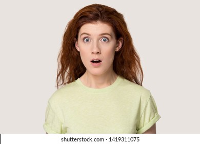 Head shot portrait on grey shocked foxy girl make big eyes open mouth gawp look at camera feels frightened received unbelievable terrified news, watch thriller movie, horrified life situations concept - Shutterstock ID 1419311075