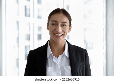 Head Shot Portrait Of Smiling Beautiful Young Caucasian Ambitious Businesswoman Worker In Formal Wear. Profile Photo Of Attractive 30s Female Team Leader Manager Employee Or Company Representative.