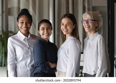 Head Shot Portrait Of Smiling Diverse Employees Colleagues Standing In Office Together, Coworkers Team Posing For Corporate Photo, Staff Members With Mature Executive Manager Leader Wearing Glasses