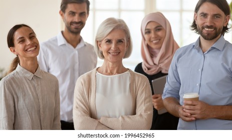 Head Shot Portrait Smiling Multiethnic Employees Group With Mature Businesswoman Executive Team Leader Looking At Camera, Happy Diverse Colleagues Posing For Photo In Office, Unity And Cooperation
