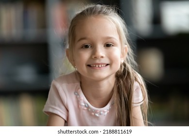 Head Shot Portrait Smiling Pretty Little Girl Looking At Camera, Happy Preschool Child Playing With Camera, Recording Vlog, Making Video Call, Chatting Online With Relatives, Using Webcam