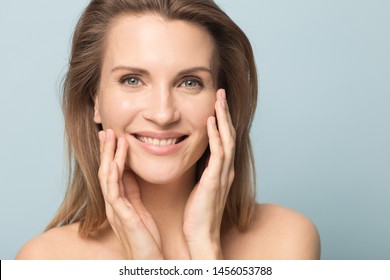 Head Shot Portrait Smiling Woman Touching Perfect Smooth Face Skin, Looking At Camera, Attractive Young Female With Bare Shoulders, Natural Beauty Concept, Close Up Isolated On Studio Background