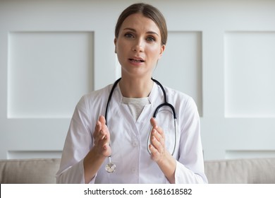 Head shot portrait woman doctor talking online with patient, making video call, looking at camera, young female wearing white uniform with stethoscope speaking, consulting and therapy concept - Shutterstock ID 1681618582