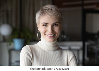 Head Shot Profile Portrait Of Young Happy Short Haired Blonde Businesswoman In Modern Office. Smiling 30s Female Manager, Talented Corporate Employee, Confident Saleswoman Looking At Camera.