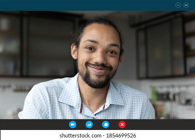 Head Shot Smiling Young African Ethnicity Guy Looking At Web Camera, Enjoying Distant Communication Or Online Study, Talking With Friends Or Colleagues, Computer Video Call Application Screen View.