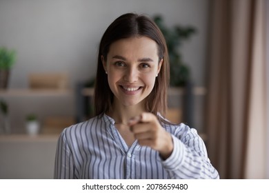Head shot smiling young beautiful female hr manager pointing finger at camera, making choice, employing job applicant, needs you for corporate career, professional human resources recruitment concept.