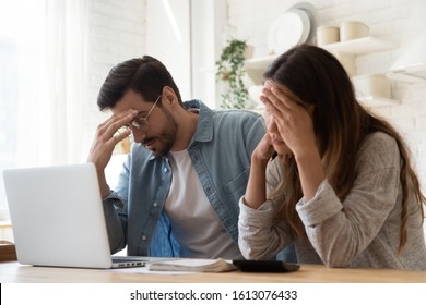 Head Shot Stressed Young Family Couple Feeling Disappointed By High Utility Bills, Money Loss. Unhappy Nervous Married Spouse Received Debt Mortgage Notification, Checking Financial Documents.