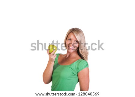 Head shot of woman holding apple against white background