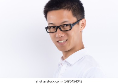 Head Shot Of A Young Asian Businessman, Happy And Smiling, Studio Shot, Isolated On White Background.