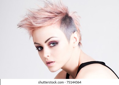 Head And Shoulders Portrait Of An Attractive Young Woman With Wild Pink Hair. Horizontal Shot.