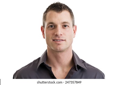 Head and shoulders portrait of a mid 30s casual businessman isolated on a white background