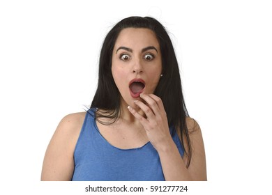 Head And Shoulders Portrait Of Young Beautiful Hispanic Woman Surprised In Shock And Disbelief  Isolated On White Background In Emotion And Opened Mouth Surprise Face Expression