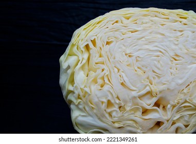 Head Of White Cabbage On A Black Background