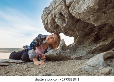 The Head Of A Woman In The Mouth Of A Stone Monster, A Mouth With Sharp Teeth, A Comic Image.