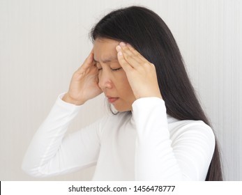 headache and neuropathic pain,haemophilus influenzae type B and ischemic stroke in asian woman head on isolated white background use for health care concept.