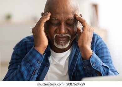 Headache. Senior African American Man Suffering From Migraine Pain Massaging Temples Sitting At Home. Healthcare, Health Problems In Older Age Concept - Powered by Shutterstock