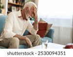 Headache, senior man and stress in home for mistake, mental health and brain fog in retirement. Face, tired and frustrated elderly guy with migraine, crisis and pain of vertigo, trauma and fatigue.