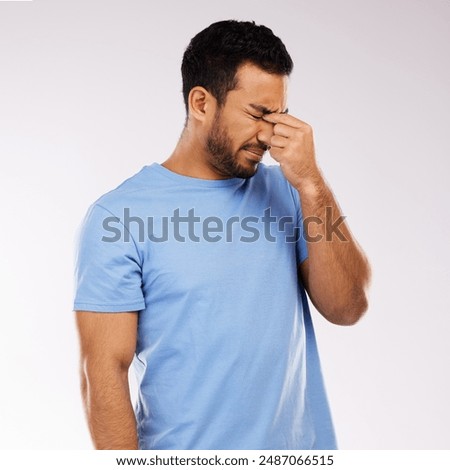 Headache, sick and man in studio for sinus allergy, cold and influenza with stress on white background. Pain, crisis or Asian model with hayfever, migraine or infection of virus bacteria congestion
